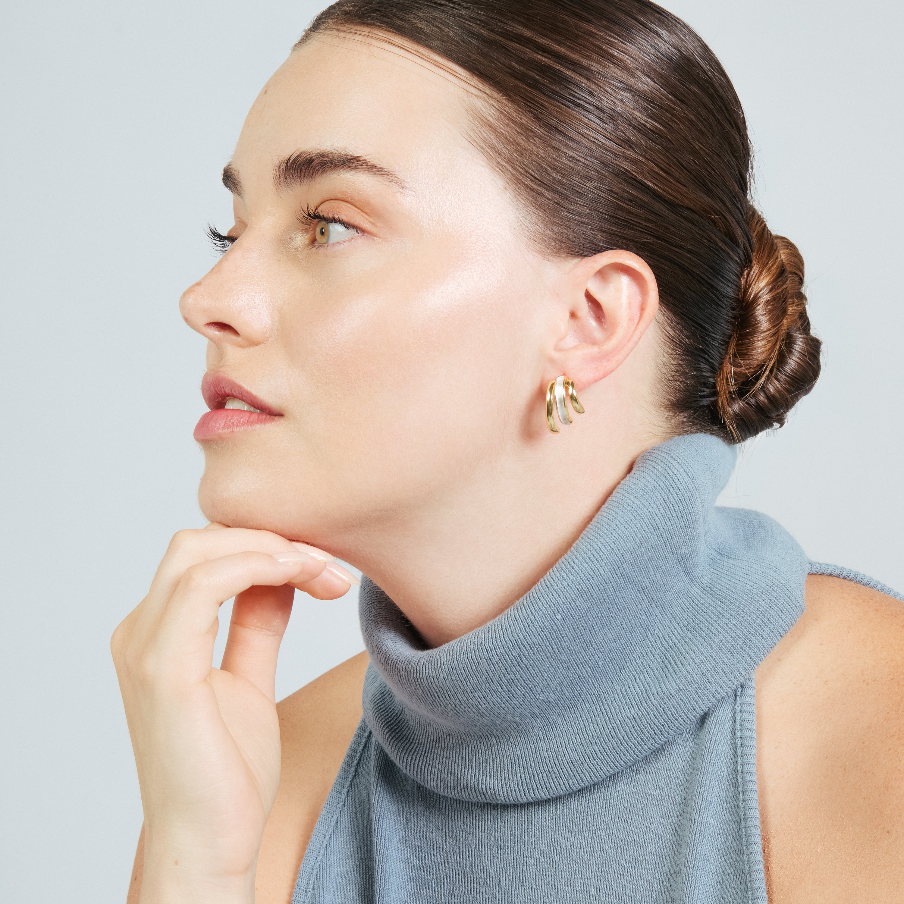 Eresron earrings finished in rhodium, 18k yellow gold, and rose gold