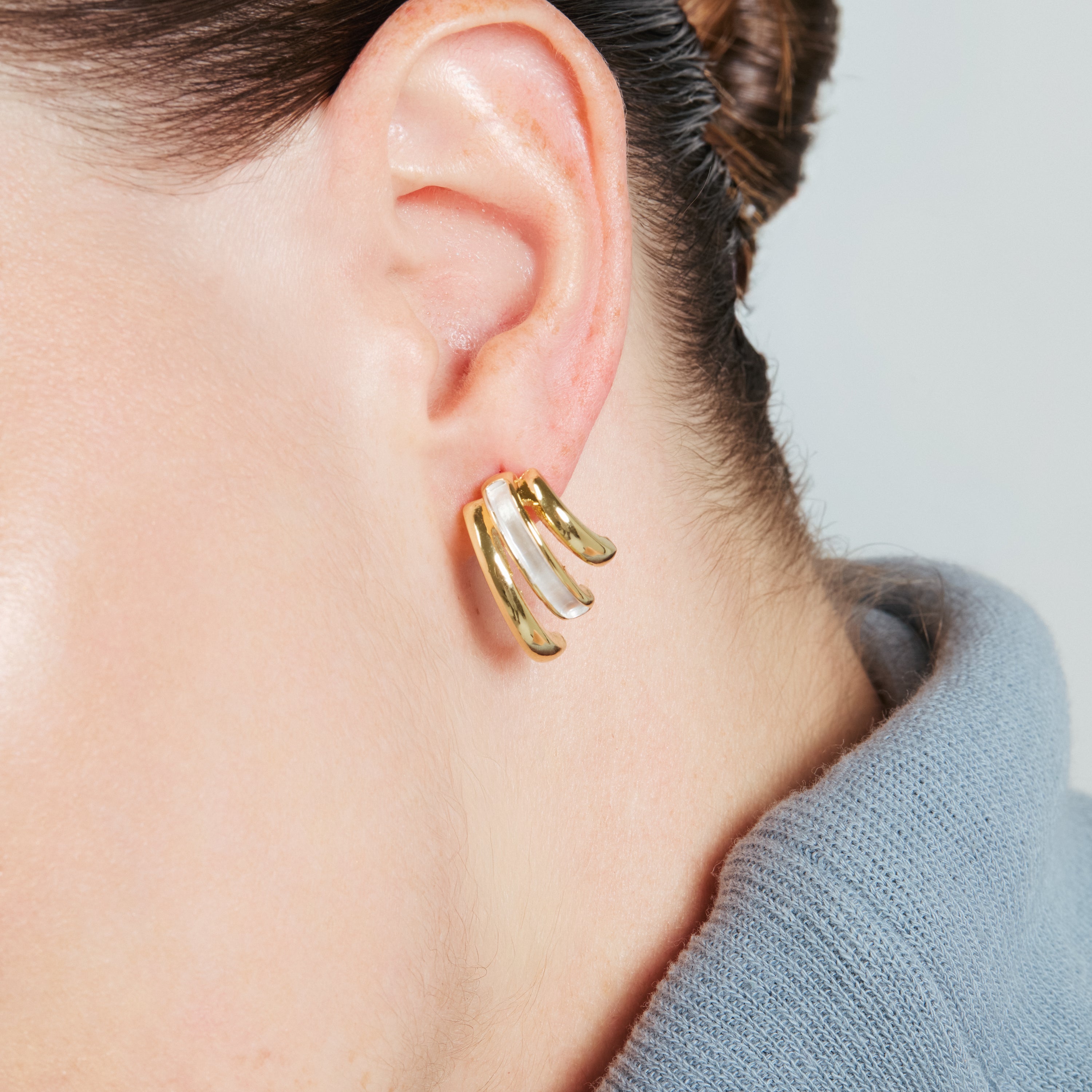 Eresron earrings finished in rhodium, 18k yellow gold, and rose gold